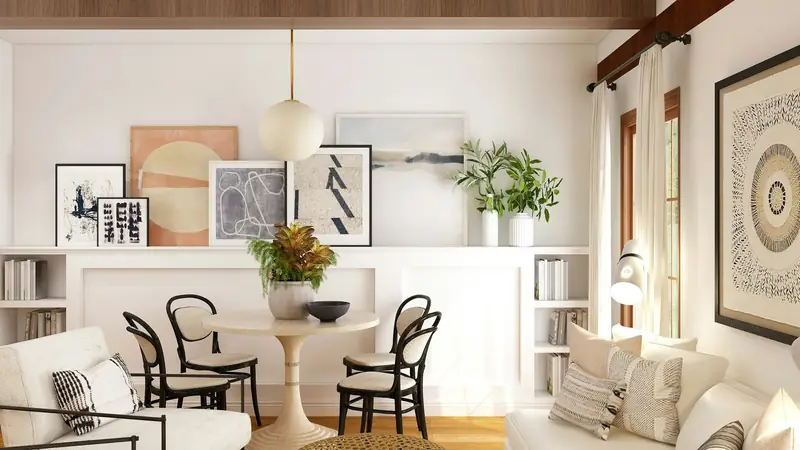 Tidy living and dining room with white furniture and wood floors